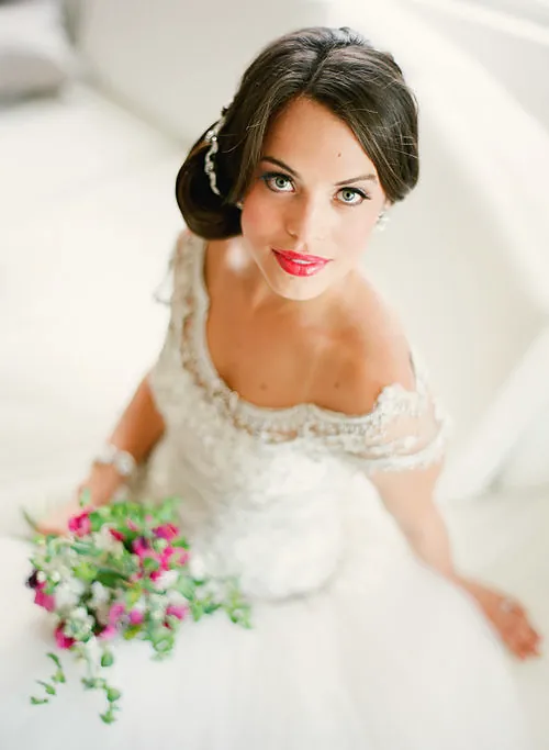 Bride in a cap-sleeve gown with a hair comb