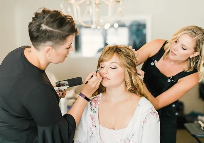 Two artists working on a client at the same time